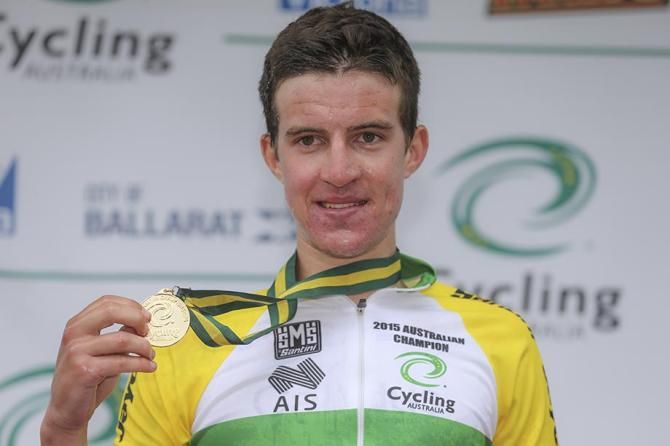 Miles Scotson poses with his gold medal
