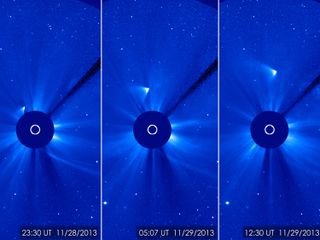 Comet ISON appears as a white smear heading up and away from the sun in this SOHO spacecraft view taken on Nov. 28, 2013 after the comet's close solar passage. The comet appears to have survived the fiery flyby, NASA scientists say.