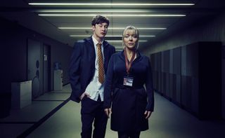 Sheridan Smith as Jenna, standing in a school corridor wearing a staff ID badge, next to Samuel Bottomley as Kyle, wearing school uniform - the two of them are looking directly into the camera