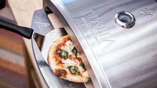 Camp Chef Italia Artisan Pizza Oven cooking pizza