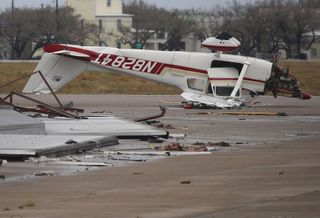 An airplane is seen flipped on its roof at the Aransas County Airport after Hurricane Harvey passed through Rockport, Texas, on Aug. 26, 2017.