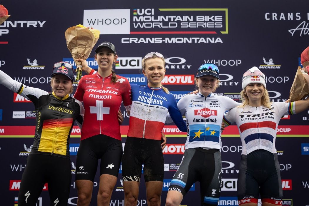 Elite women&#039;s podium in Crans Montana for WHOOP UCI MTB World Series XCO race, won by Loana Lecomte