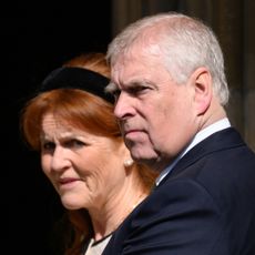 Sarah Ferguson has red hair and stands next to ex-husband Prince Andrew