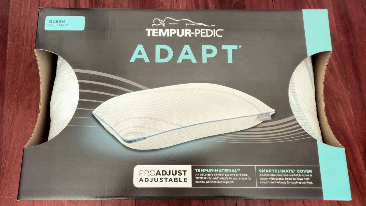 The Tempur-Pedic Tempur-Adapt ProAdjust Pillow in a box on a redwood floor
