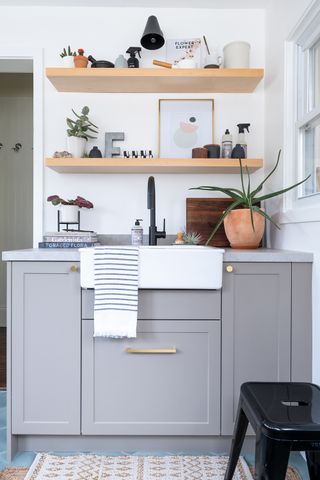 Laundry room with grey shaker sink unit and a Belfast sink