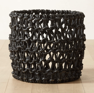 Black woven rattan storage basket.