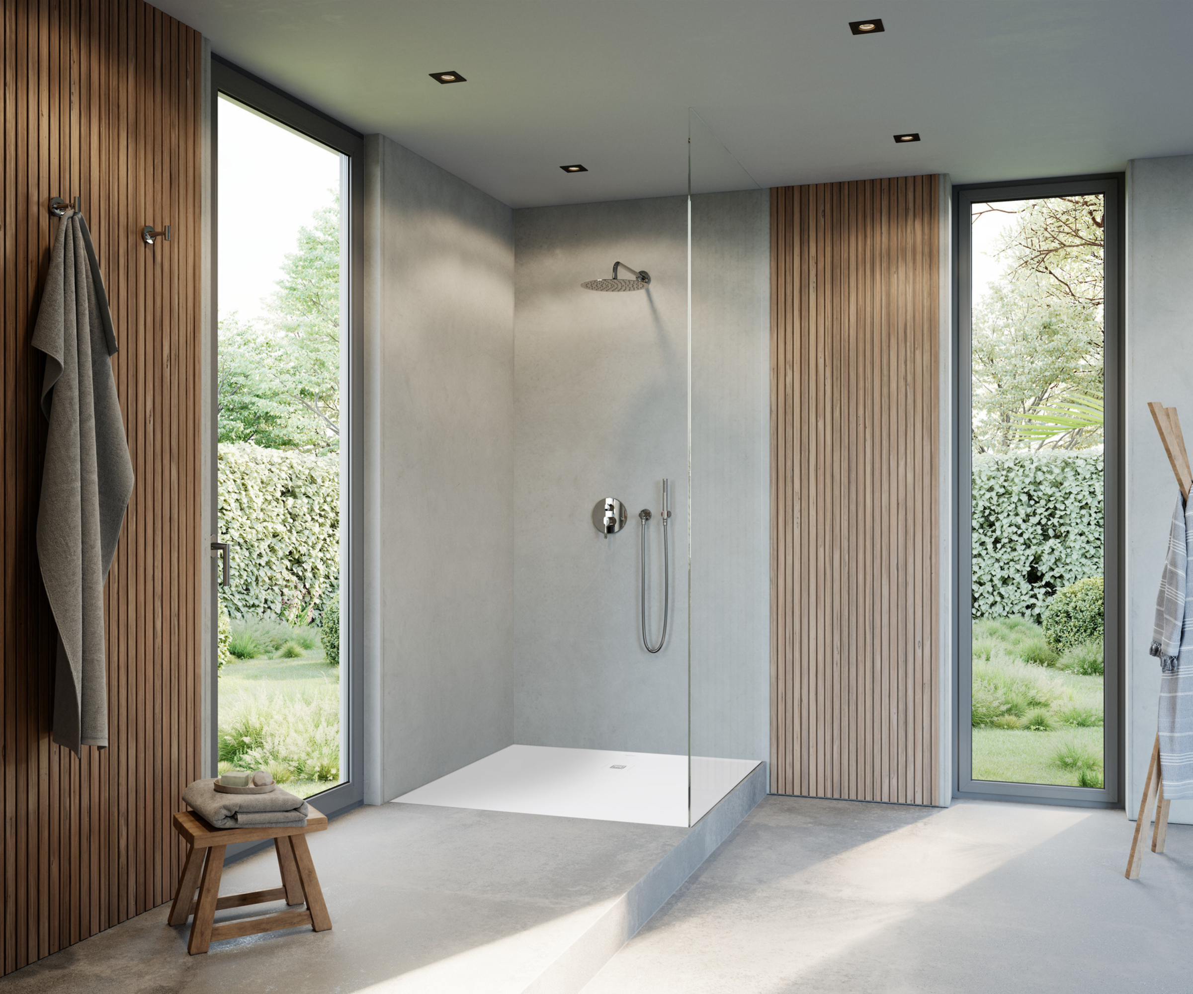 walk in shower with glass screen on raised platform in bathroom with slatted wood panelling, floor to ceiling narrow windows and tiled floor