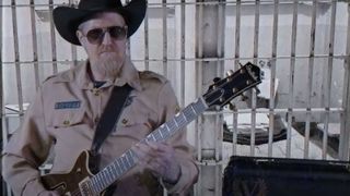 Brent Hinds stars in Victory Amps’ video as Super Sheriff Dirty B. Hinds