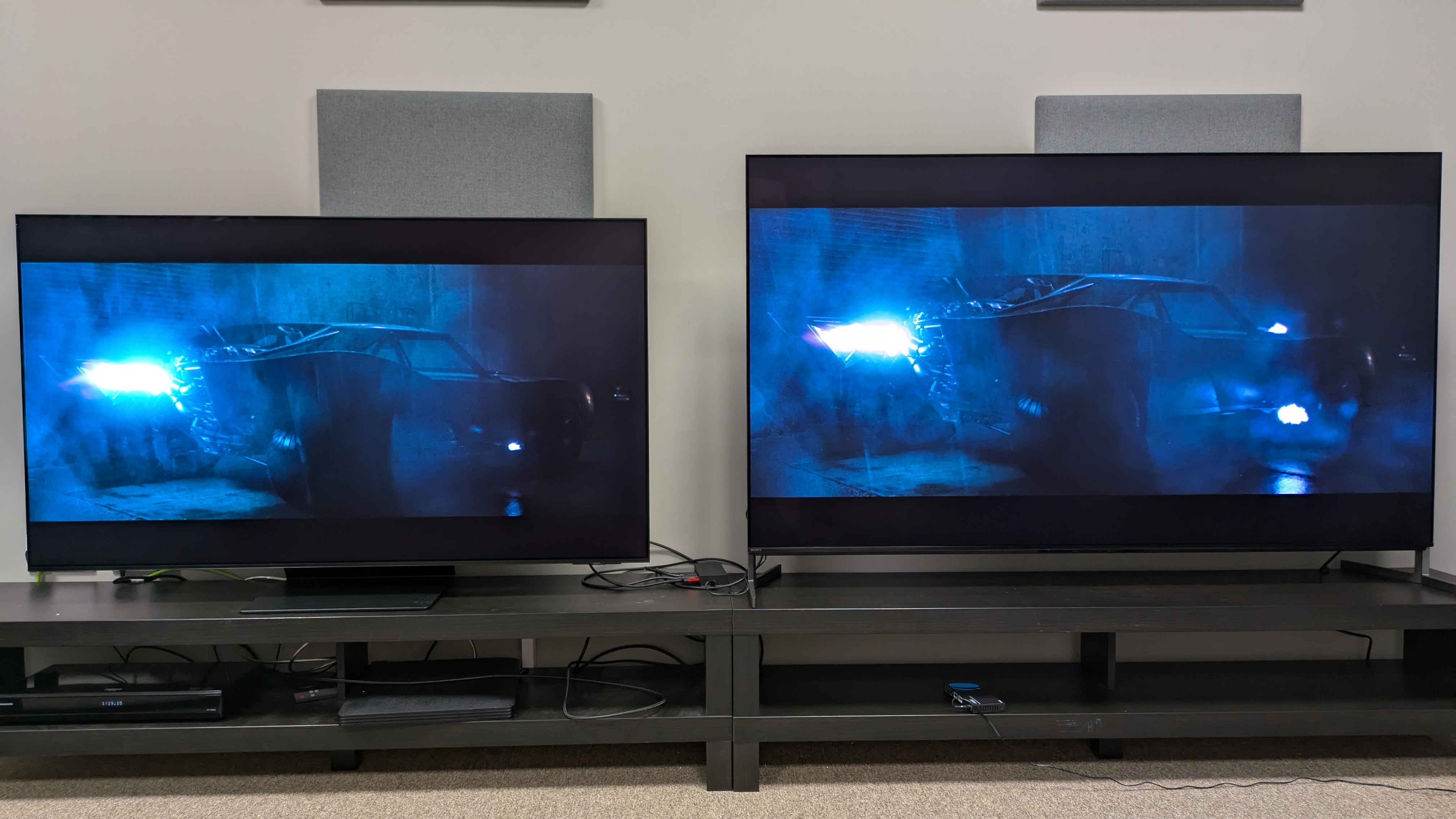Samsung S95F (left) and Sony Bravia 8 II (right) with the Batmobile from The Batman on screen