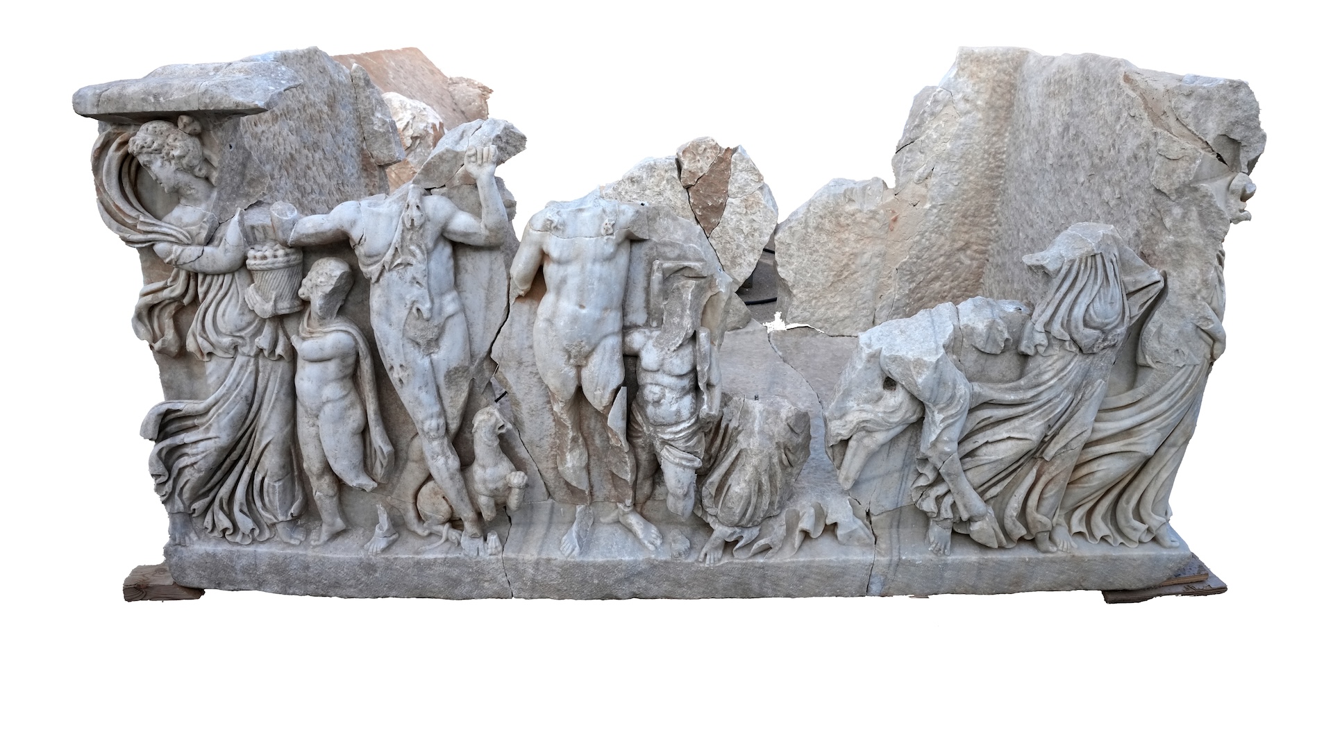 An image of a damaged sarcophagus depicting a scene with Roman figures