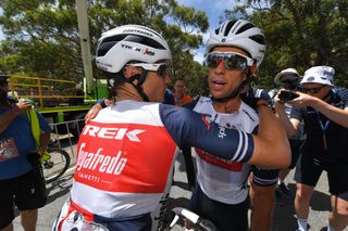 Richie Porte celebrates his overall win with a teammate