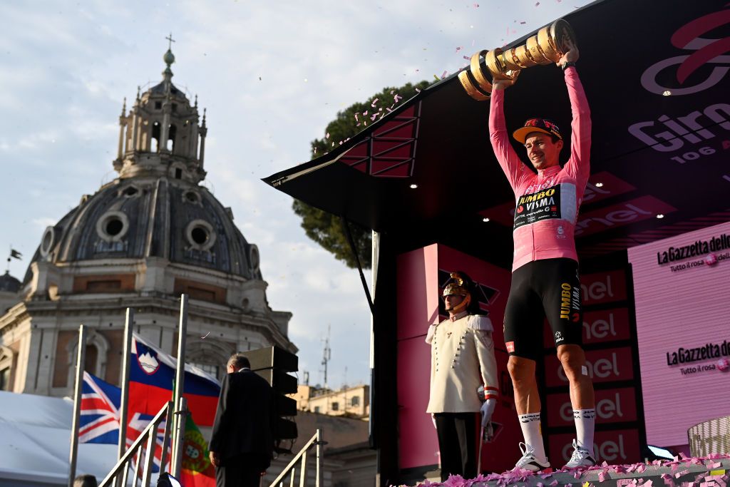 ROME ITALY MAY 28 Primo Rogli of Slovenia and Team JumboVisma Pink Leader Jersey celebrates at podium with the Trofeo Senza Fine as final overall race winner during the 106th Giro dItalia 2023 Stage 21 a 126km stage from Rome to Rome UCIWT on May 28 2023 in Rome Italy Photo by Tim de WaeleGetty Images