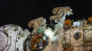 Cosmonauts Anton Shkaplerov (left) and Pyotr Dubrov (right) work to outfit the Nauka multipurpose laboratory module during a seven-hour and 11-minute spacewalk Jan. 19, 2022.