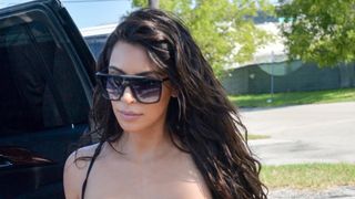 Kim Kardashian wearing big sunglasses.