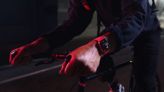 Apple Watch Series 7 being used by someone riding a bike