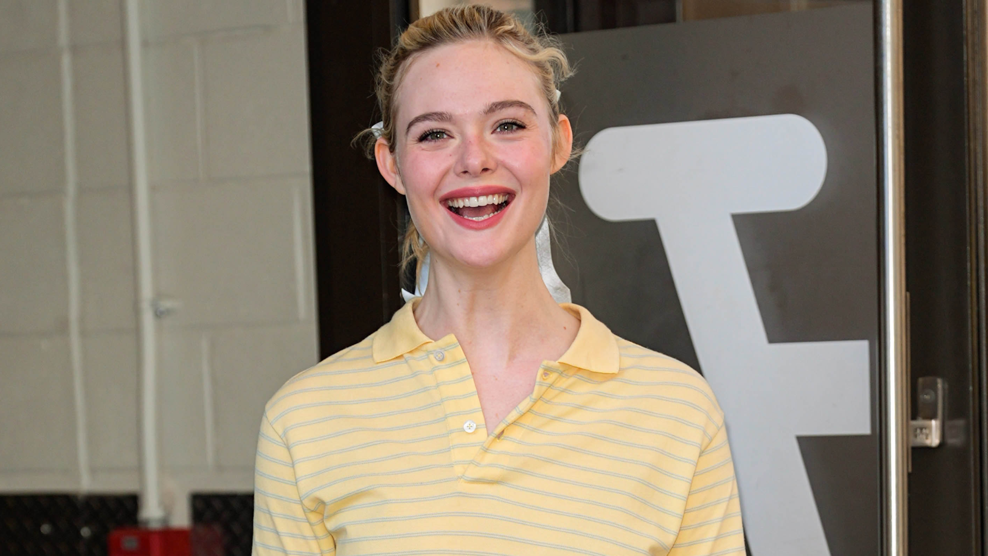 Elle Fanning promoted 'Margo's Got Money Troubles' in a butter yellow polo shirt, a tutu skirt, and the doll heels trends