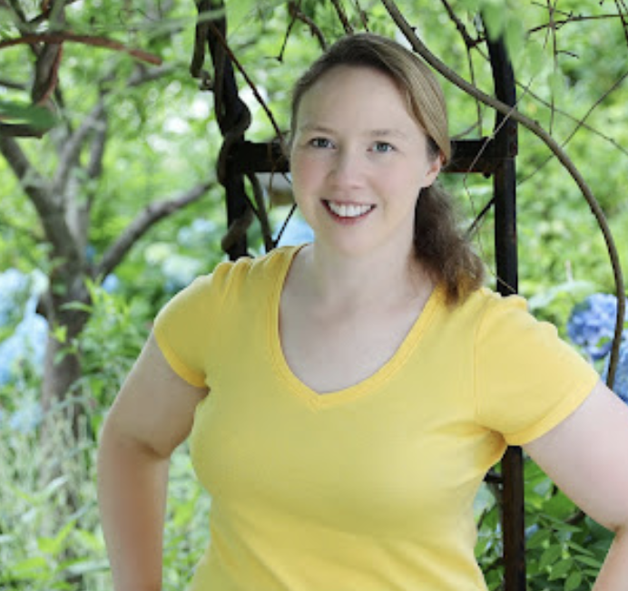 smiling woman wearing yellow t-shirt