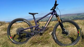 The Santa Cruz Hightower V4 seen from the side on a grassy moor