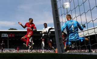 Darwin Nunez of Liverpool flicks the ball to score their teams first goal during the Premier League match between Fulham FC and Liverpool FC at Craven Cottage on August 06, 2022 in London, England.