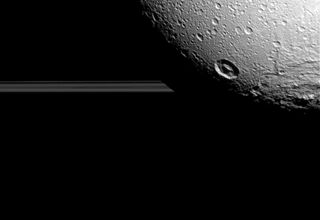 Dione's Craters and Saturn's Rings