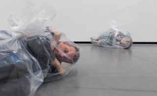 People wrapped in clear plastic: artwork from The Irreplaceable Human exhibition at Louisiana museum Denmark