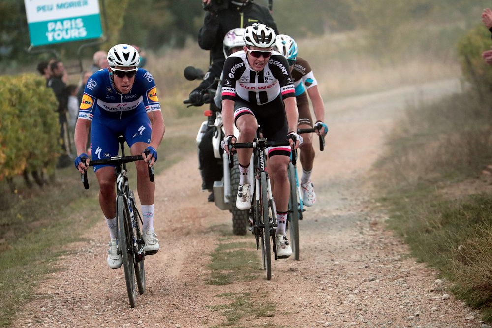Niki Terpstra, Soren Kragh Andersen and Benoit Cosnefroy ride on the gravel at Paris-Tours