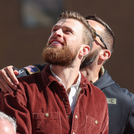 Harrison Butker looks up at the crowds during the Kansas City Chiefs Super Bowl LVIII Victory Parade on Feb 14, 2024 in Kansas City, MO. (Photo by Scott Winters/Icon Sportswire via Getty Images)