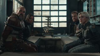 The cast sits watching something intently while tied up in Thunderbolts.