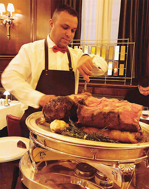 Manzil Diniz, master carver at Simpson's on the Strand