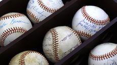 A box of signed baseballs as collectibles.