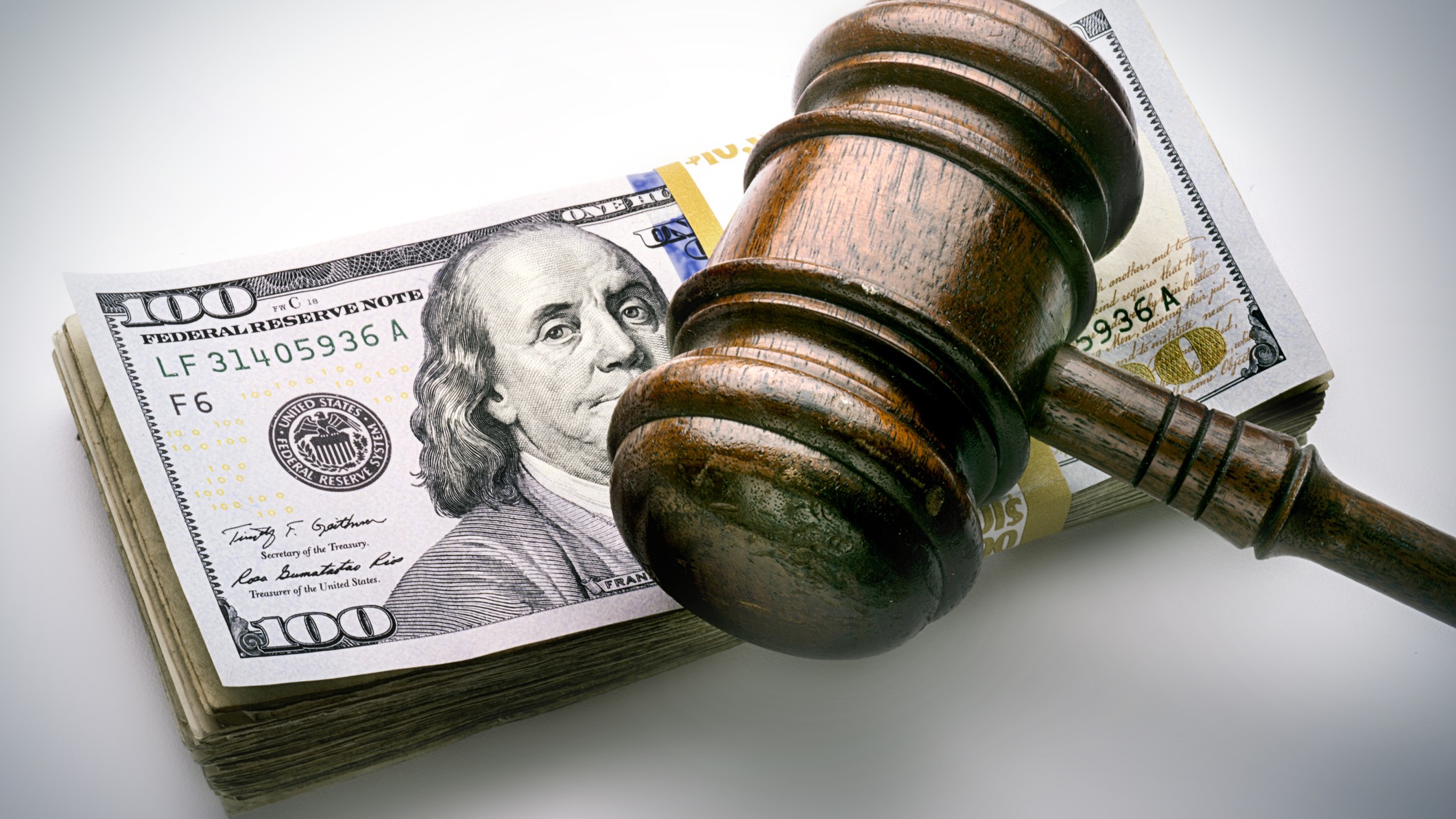 judge's gavel on money