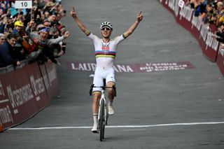 Team UAE's Slovenain rider Tadej Pogacar celebrates as he crosses the finish line to win the 19th one-day classic 'Strade Bianche' (White Roads) men's cycling race between Siena and Siena in Tuscany on March 8, 2025. (Photo by Marco BERTORELLO / AFP)