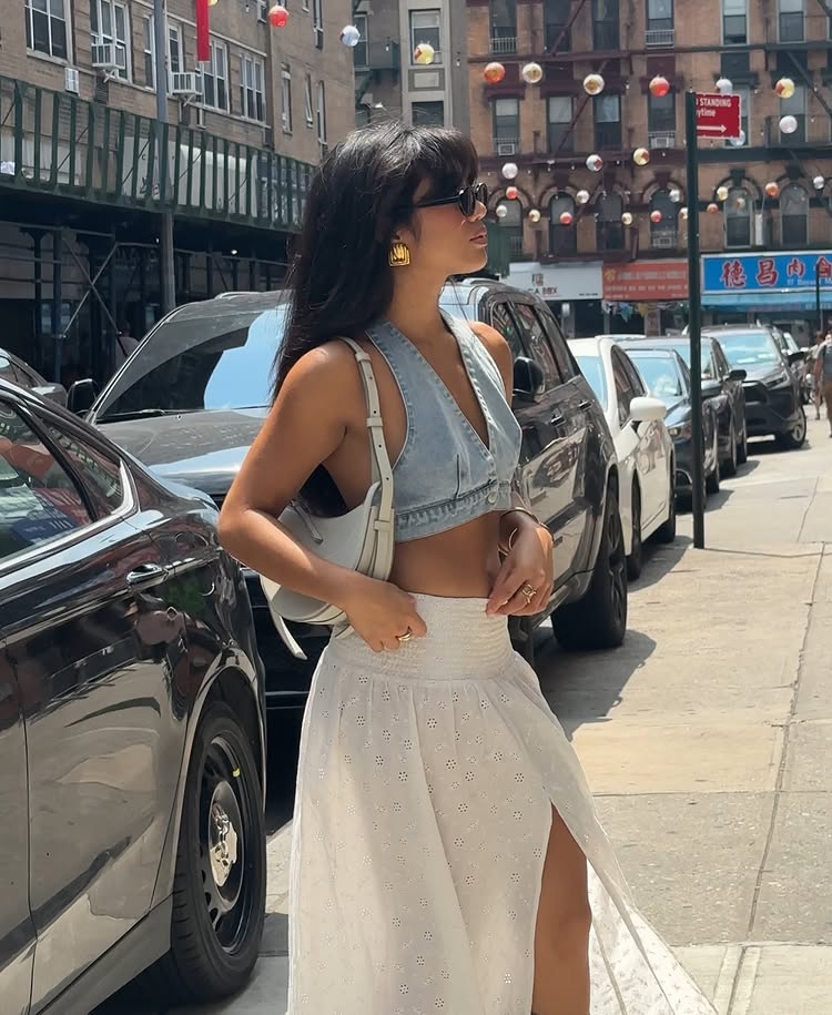 @jeannine.roxas wears a denim bra top with a white skirt