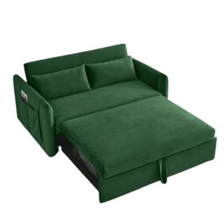 A green crushed velvet sofa bed cut out on a white background.