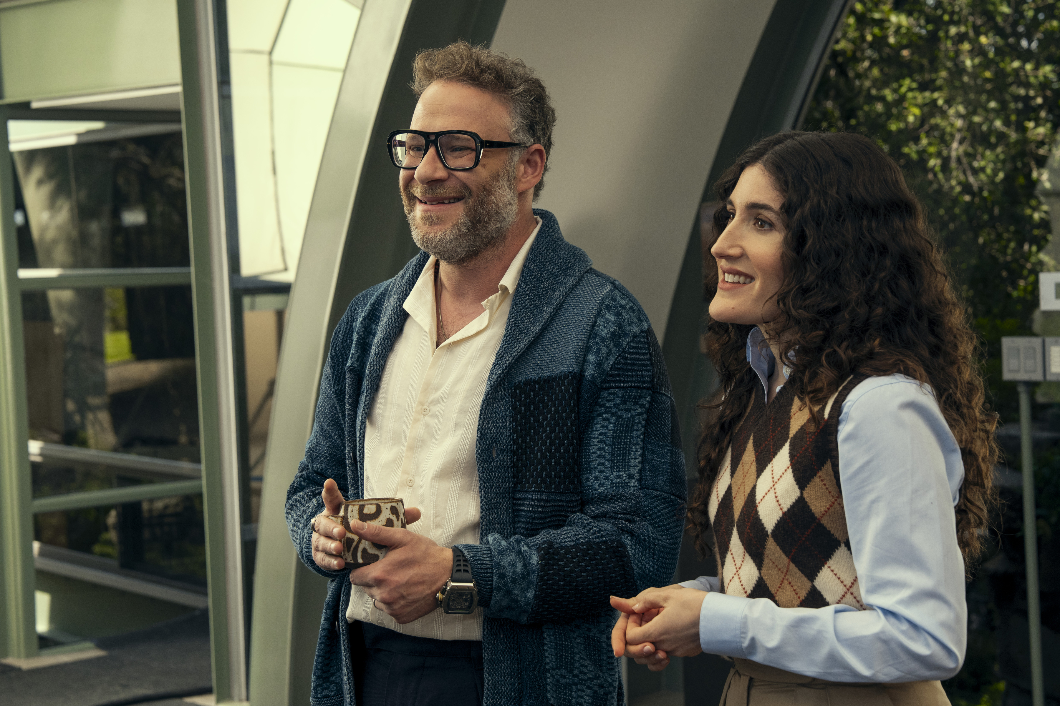 seth rogen and kate berlant in their guest starring roles smiling in a still from nobody wants this season 2
