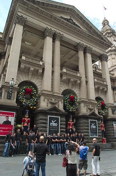 The team pose for photographs outside Melbourne's Town Hall.