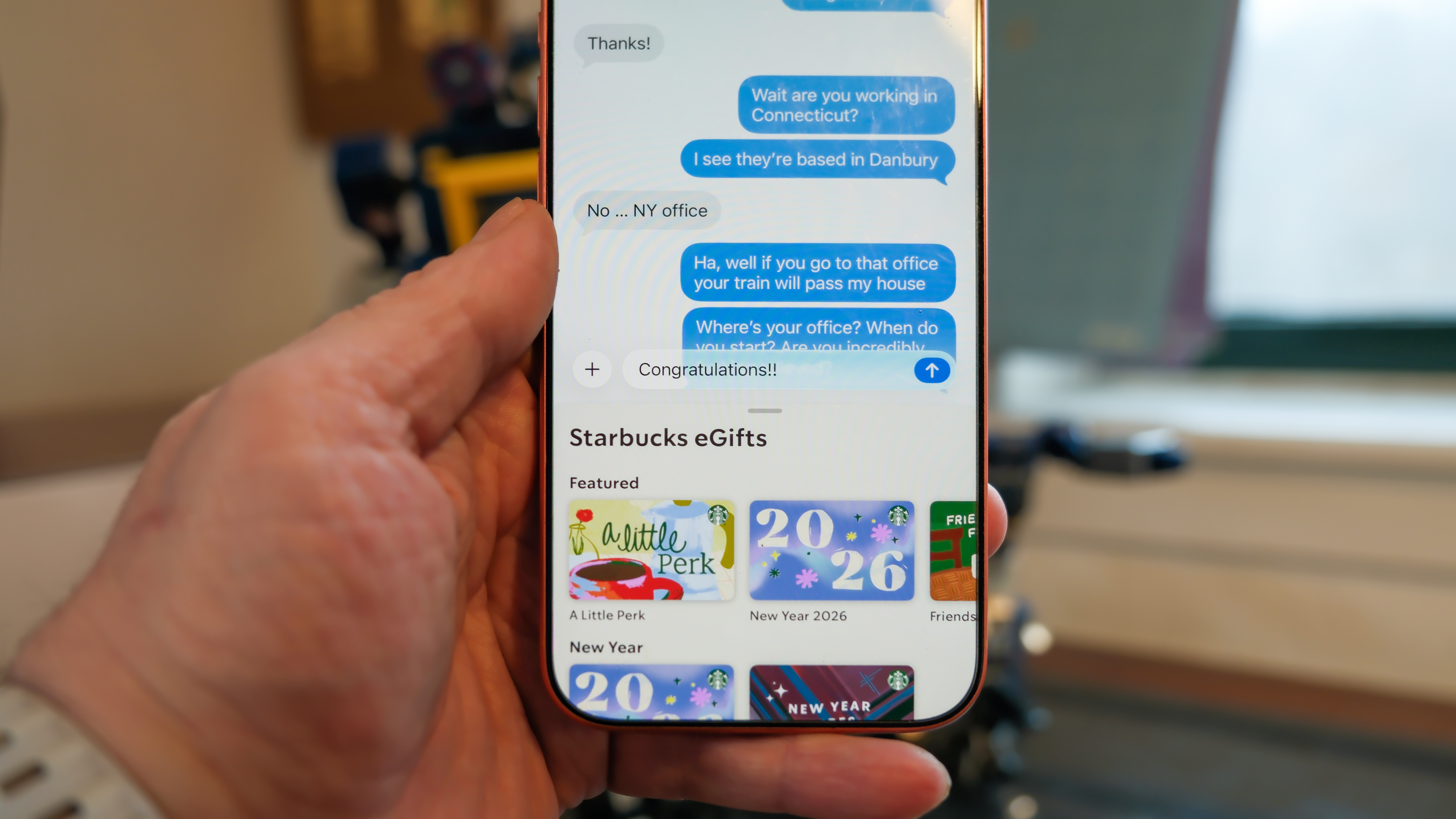 Apple iPhone 16 Pro Max in orange showing various Apple Messages features including sending check-ins, Apple Cash, and doodles