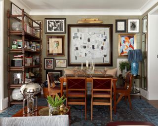dining room with feature wall of vintage artworks with mid century wooden dining table and chairs