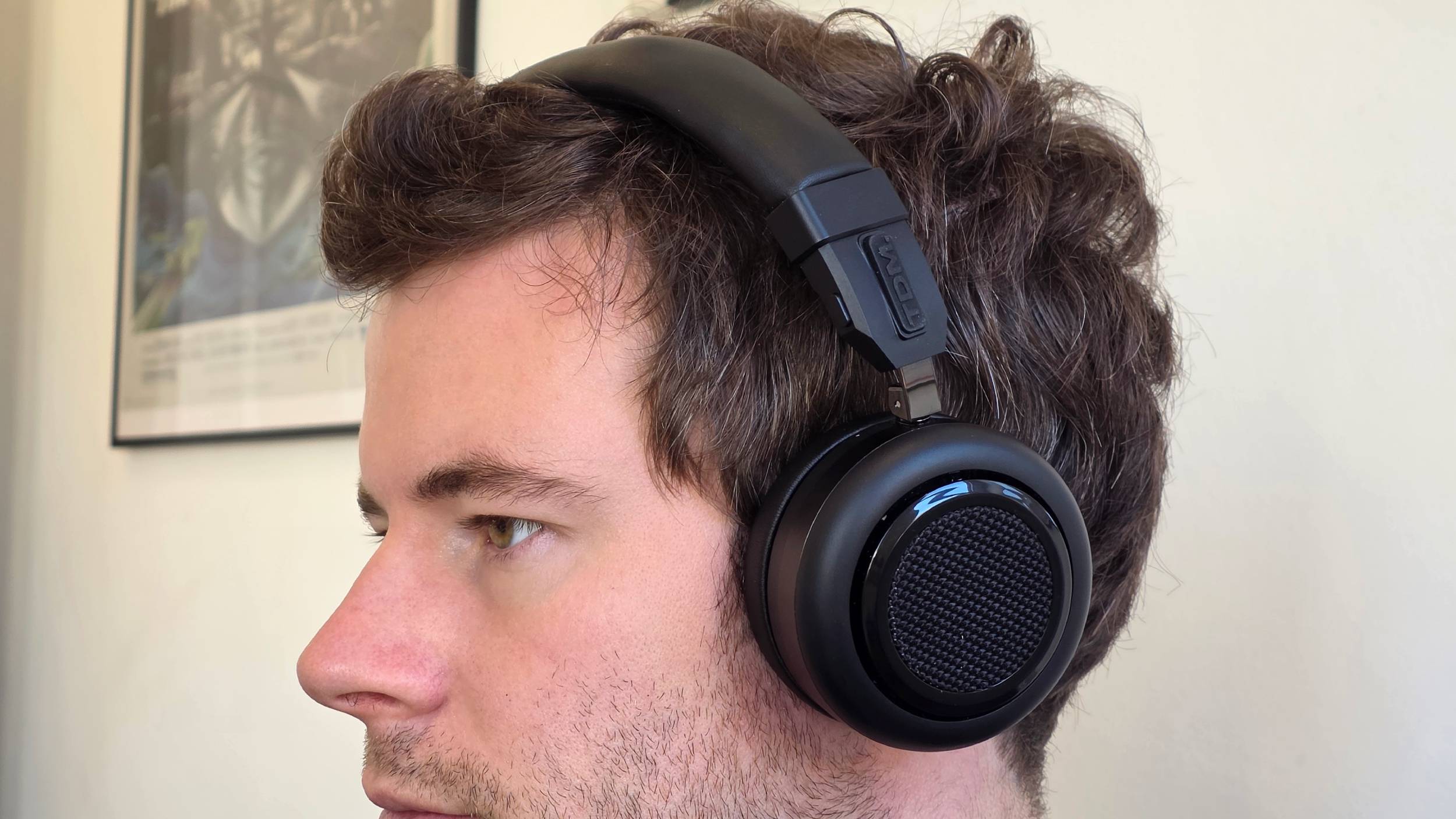 The TDM Neo in headphone format on a man's head.