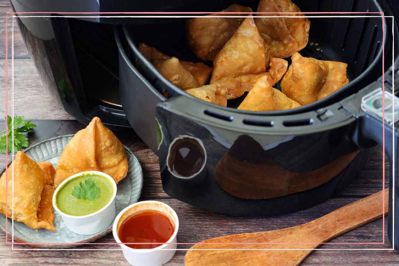 An open air fryer with samosas inside