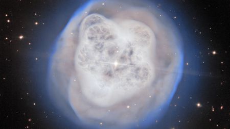 A glowing ball of white gas in the darkness of space