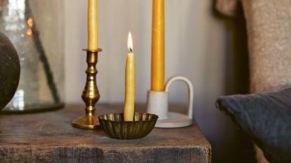 These Gold And Bronze Candle Holders Are Inspired By The Past