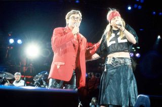 Elton John and Axl Rose of Guns N' Roses perform on stage at the Freddie Mercury Tribute Concert, Wembley Stadium, London, 20th April 1992