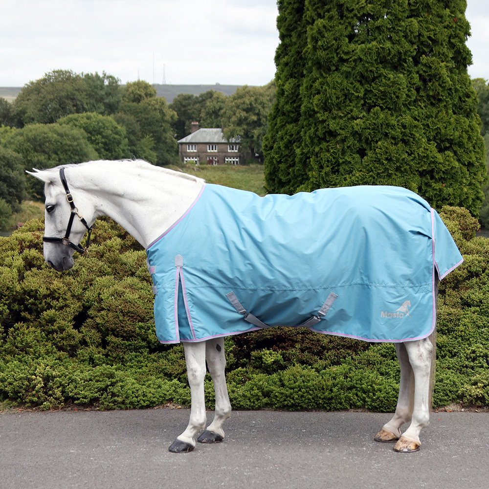 Side view of a grey horse wearing a Masta Ventomasta 0g Turnout Rug