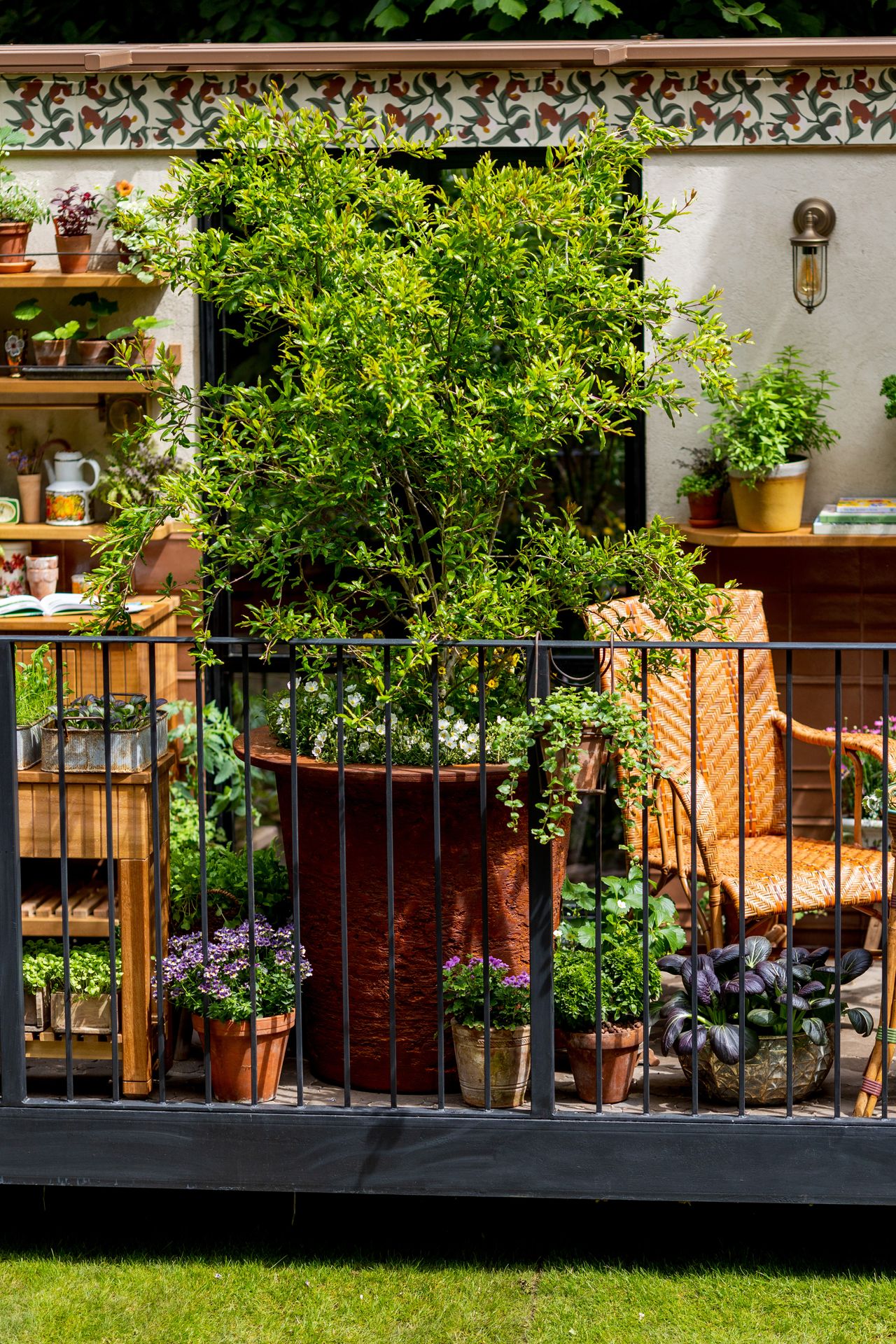 Images and close ups of the balcony garden by Viking, titled A Little Garden of Shared Knowledge.