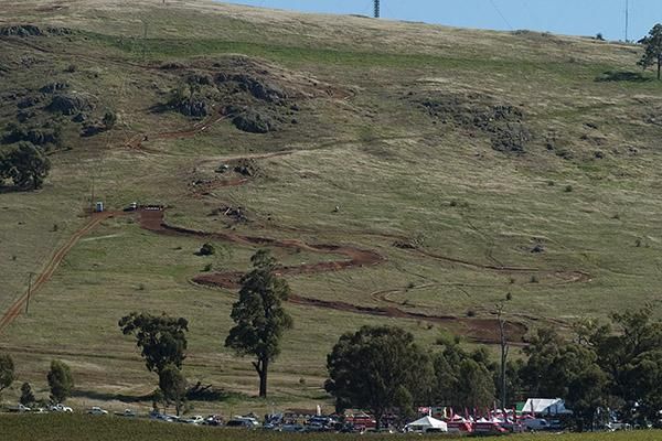 The downhill course on Mt. Major near Shepparton where riders began from beyond top left; the four cross starting gate to the left.