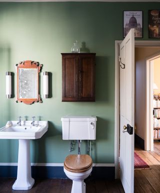 green bathroom with traditional sanitaryware