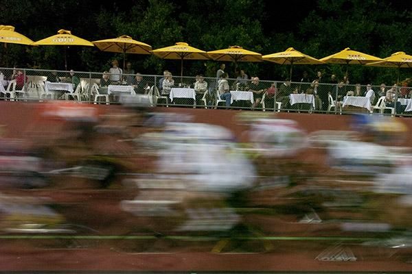 Riders are a blur as diners watch on from their tables.