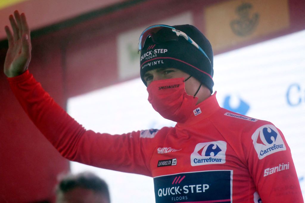 Team Quick Steps Belgian rider Remco Evenepoel celebrates on the podium wearing the overall leaders red jersey after the 6th stage of the 2022 La Vuelta cycling tour of Spain a 1812 km race from Bilbao to San Miguel de Aguayo on August 25 2022 Photo by Ander GILLENEA AFP Photo by ANDER GILLENEAAFP via Getty Images