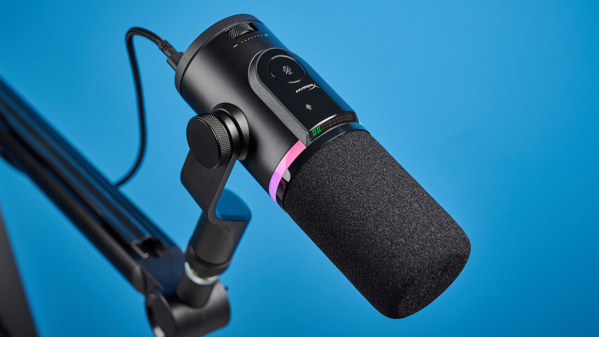the hyperx flipcast streaming microphone on a boom arm with an RGB LED panel and an xlr and usb-c connectivity